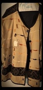 Aztec style lined jacket with decorations.